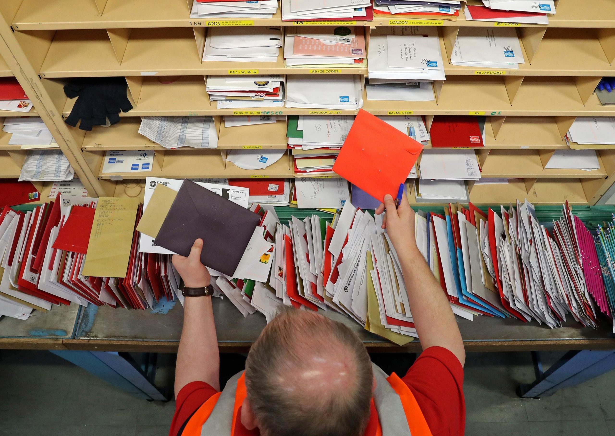 Man sorting parcels